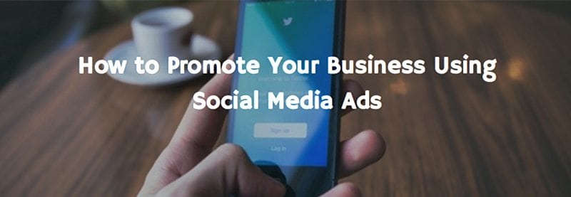 an image of a person holding a phone and the text overlay reads "How to promote your business using social media ads"