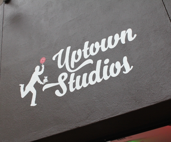 Uptown Studios Uptown Studios logo on the outside of building